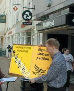 Stephen collecting signatures. "We need Police, not Soundbites, to combat crime"