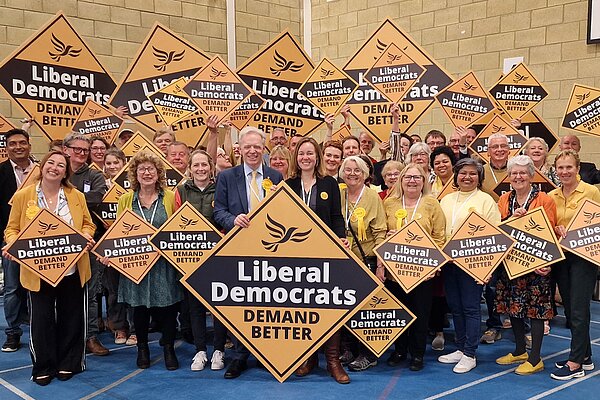 Group of Liberal Democrats smiling and holding diamonds