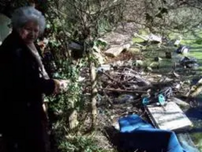 Cllr. Nichols surveys the scene of St. Peter's pond