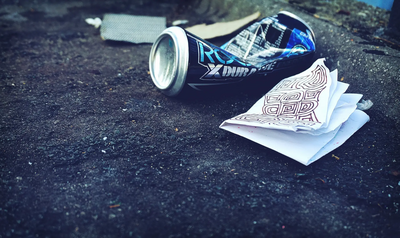 Photo by Suzy Hazelwood: https://www.pexels.com/photo/grey-beverage-bottle-1098684/ rubbish on street