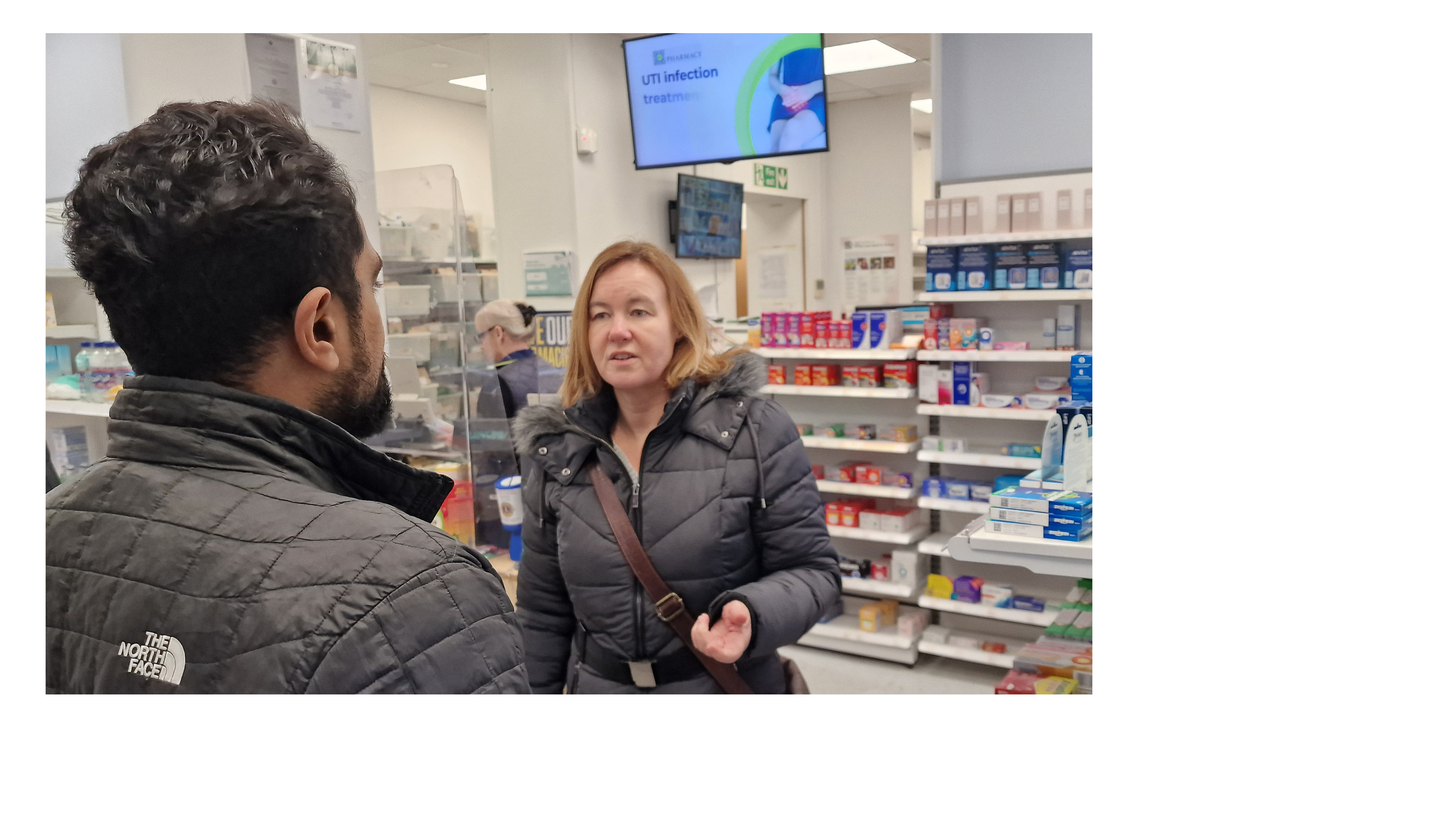 Liberal Democrat candidate Marie Goldman talks to pharmacist
